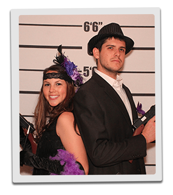 New Orleans Murder Mystery party guests pose for mugshots