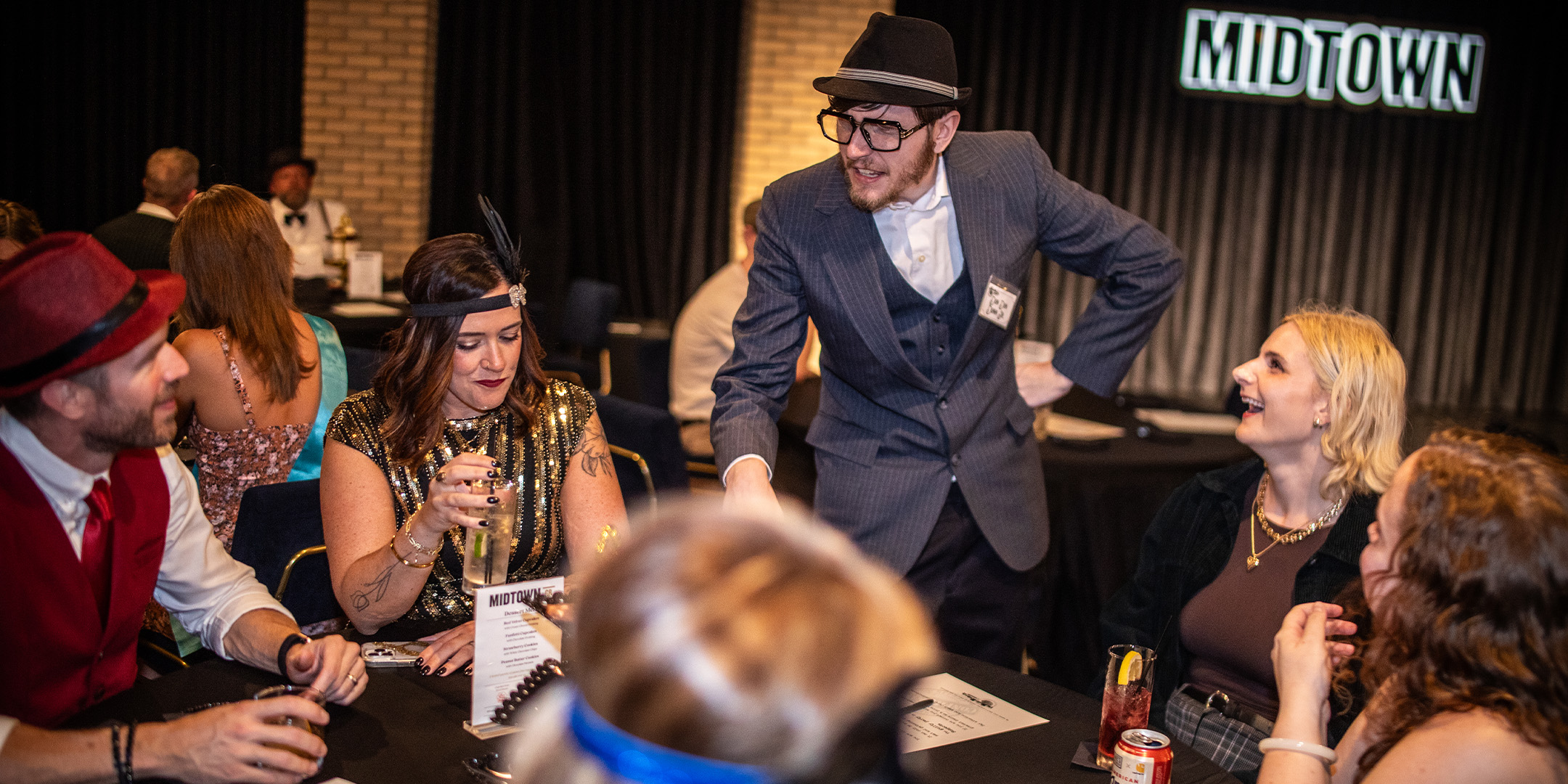 Guests at a Murder Mystery Company public dinner show in New Orleans